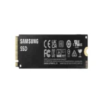 Underside of the 2TB NVMe SSD showing the copper heat dissipation layer and surface-mounted components.