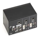 Black Box DT Series KV9702A desktop KVM switch back view showing 2 DisplayPort computer inputs, 6 USB 2.0 ports (4 for peripherals, 2 for keyboard/mouse), 3.5mm audio jacks for microphone and speaker, and power input