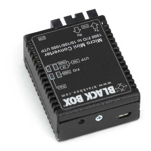 Black Box LMC4004A media converter back view showing power input, configuration DIP switches, and chassis mounting interface