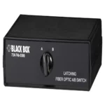 Black Box SW1036A fiber optic A/B switch front view showing front panel rotary knob for selecting COMMON port connection between Network A or Network B, with three SC singlemode fiber connector pairs